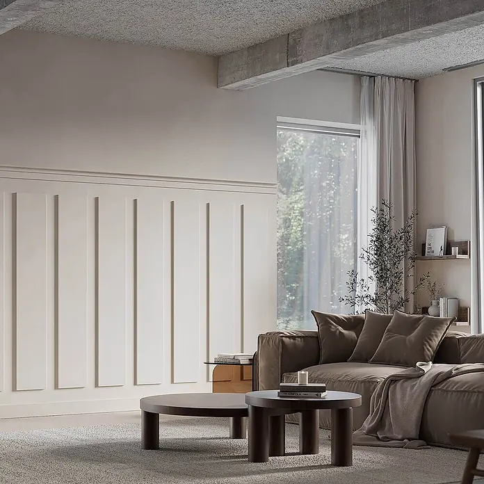 Orac Sockelleiste SX207F flexible Sockelleiste Fußleiste Wandpaneel Wandleiste 2 m - leicht, robust, extrem maßhaltig - Braunes Modulsofa und zwei runde Couchtische aus dunklem Holz in einem modernen Wohnzimmer.