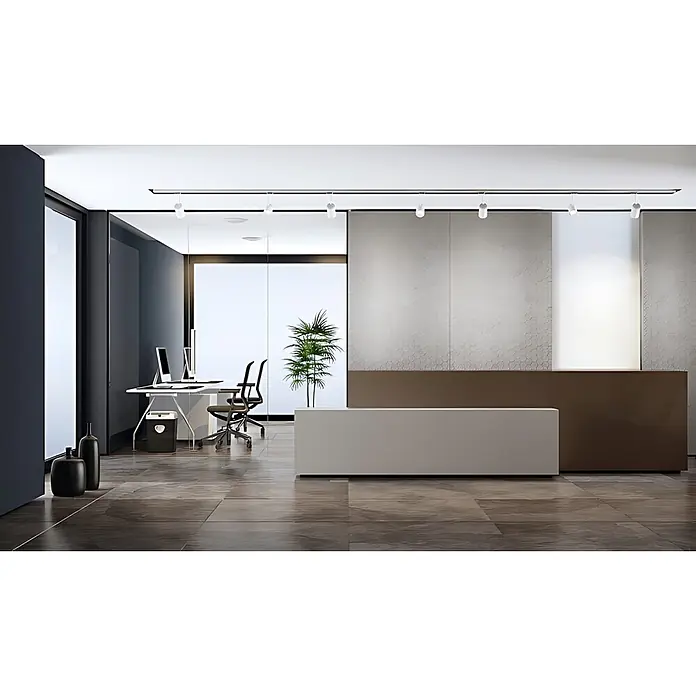 Wallface Wandpaneel 22712 COMB VELVET Pearl Wandverkleidung Honigwaben Optik matt grau 2,60 m2 - 2.600 x 1.000 mm - Moderne Büromöbel, darunter ein hellgrauer Empfangstresen, in einer Bürolobby.