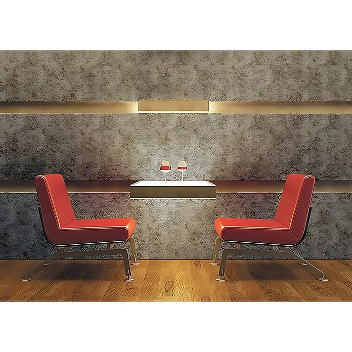 Wallface Wandpaneel 17275 DECO VINTAGE Wandpaneel Metall-Rost-Optik Design grau 2,60 qm - dunkel-grau, 2.600 x 1.000 mm - Zwei moderne rote Loungesessel stehen sich in einem zeitgenössischen Ambiente mit einem leuchtenden Regal und zwei Weingläsern gegenüber.
