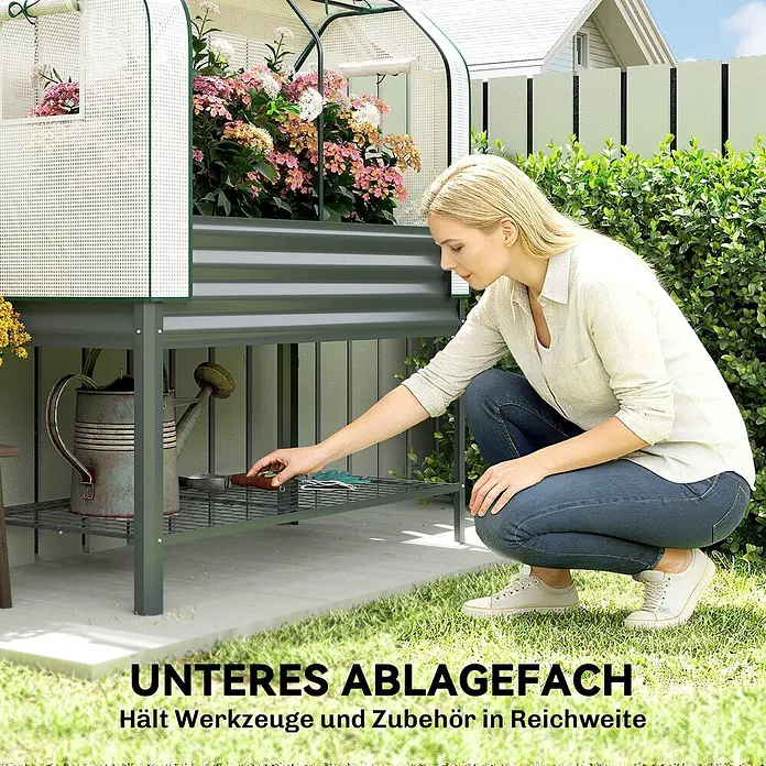 Outsunny Hochbeet Mit Frühbeetaufsatz - Metall, Dunkelgrau - Graues Hochbeet mit Gewächshaus und praktischem Gitterboden für Gartengeräte. Eine Frau greift nach Zubehör.