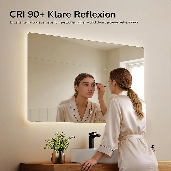 Emke Lichtspiegel Glowrim LM09 -  - Rechteckiger beleuchteter Badezimmerspiegel, vor dem eine Frau Make-up aufträgt, mit klarer Reflexion.