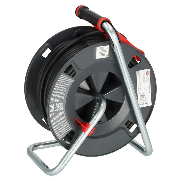 Brennenstuhl Kabeltrommel 300 KU 4100 - Kunststoff, 40 m, H07RN-F, IP44 - Dunkelgraue Kabeltrommel mit schwarzem Kabel, roten Akzenten und silbernem Metallständer zur Stromverlängerung.