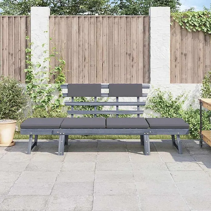 Furnicato Gartenbank Akazien-Massivholz - B x T x H: 190 x 66 x 75 cm, Grau - Graue Gartenbank aus Holz mit dunkelgrauen Kissen auf einer Terrasse.