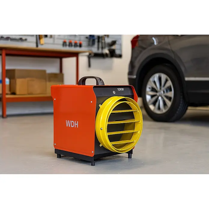 WDH Bauheizer WDH-BGP10S, 10kW Heizleistung -  - Orange-gelbe 10KW Industrieheizung in einer Werkstatt neben Werkbank und Auto.