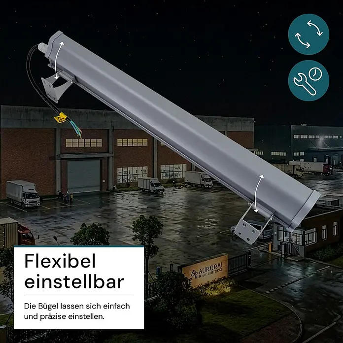 Luxula LED-Strahler LED-Hallenstrahler - 100 W, 12.400 lm, 5.000 K, IP65 - Eine lange, graue Industrie-LED-Leuchte mit verstellbaren Montagebügeln in einem nächtlichen Lagerbereich, die flexible Positionierung betont.