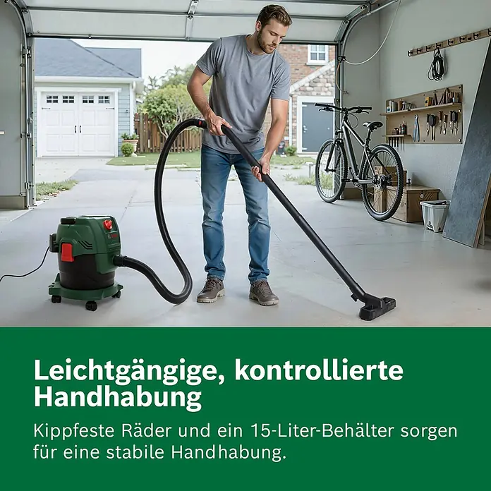 Bosch Elektro-Nass- & Trockensauger PAS 15-200 - 1.200 W, Behältervolumen: 15 l - Man nutzt grünen Bosch Nass-/Trockensauger in der Garage, mit kippfesten Rädern und 15-Liter-Behälter für stabile Handhabung.