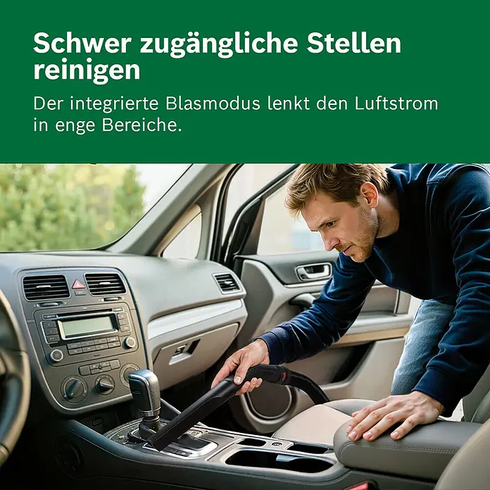 Bosch Elektro-Nass- & Trockensauger PAS 15-200 - 1.200 W, Behältervolumen: 15 l - Mann reinigt Autoinnenraum mit schwarzem Handstaubsauger. Seine Blasfunktion lenkt Luft in schwer zugängliche Stellen.