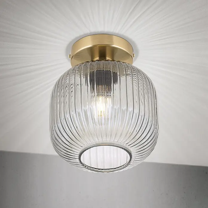 Orion Leuchten Deckenleuchte rund - E27 - Deckenleuchte aus Messing mit geripptem Glasschirm, leuchtender Glühbirne, die strahlende Muster an die Decke wirft.