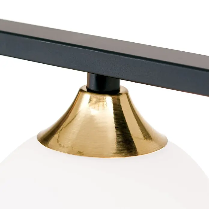 Orion Leuchten Pendelleuchte - L x B x H: 120 x 12 x 150 cm, G9 - Detail einer Leuchte: schwarze Metallstange, messingfarbene glockenförmige Verbindung und weißer Glasschirm.