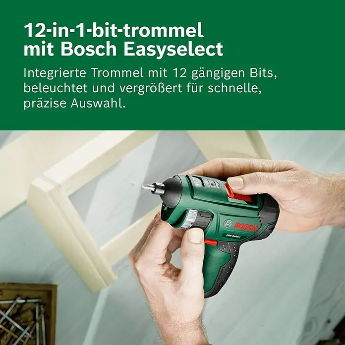 Bosch Akkuschrauber PSR Select - 3,6 V, 1 Akku, 2 Ah, 4,5 Nm - Person montiert Holzrahmen mit grün-schwarzem Bosch Easyselect Akkuschrauber mit integrierter Bit-Trommel.
