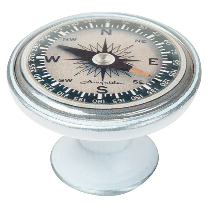 Nesu Pomo para muebles Compás - Ø x Al: 37 x 26 mm - Primer plano de un pomo de brújula decorativo con borde plateado y base blanca.