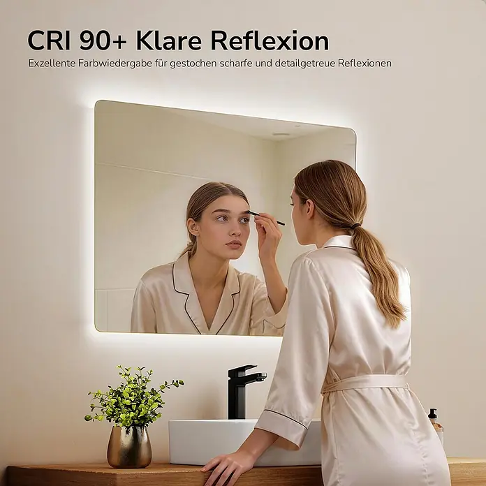 Emke Lichtspiegel Glowrim LM09 - 80 x 60 cm - Badezimmerspiegel mit integrierter LED-Beleuchtung, der eine Frau beim Schminken reflektiert. Bietet klare, detaillierte Reflexionen zur Körperpflege.