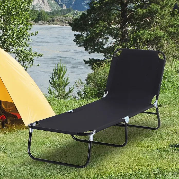 Furnicato Gartenliege - B x T: 56 x 188 cm, Schwarz, Verbundwerkstoff - Schwarzes faltbares Campingbett mit Metallrahmen, auf Gras neben einem Zelt an einem Fluss aufgestellt, bereit zum Entspannen im Freien.