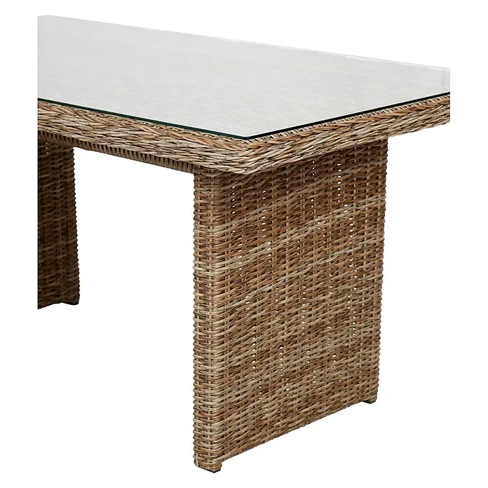 Ebuy24 Gartentisch Gram - L x B x H: 76 x 142 x 68 cm, Ø x H: 142 x 68 cm, Aluminium, Rattan, Glas Rattan = Polyrattan, Sonstige, Holz - Geflochtener Rattantisch mit klarer Glasplatte, in natürlichem Hellbraun mit stabilen Blockbeinen.