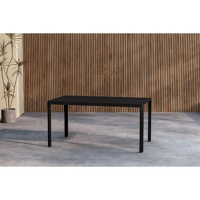 Ebuy24 Gartentisch Giardini - L x B x H: 150 x 85 x 72 cm, Ø x H: 85 x 72 cm, Aluminium, Schwarz - Schwarzer rechteckiger Outdoor-Esstisch auf einer Beton-Terrasse.