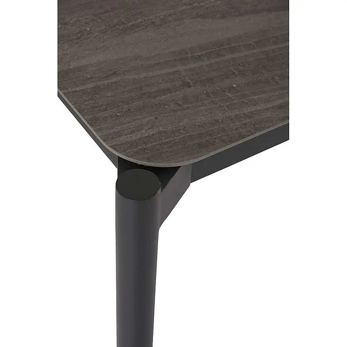 Ebuy24 Gartentisch Bo - L x B x H: 104 x 205 x 75 cm, Ø x H: 205 x 75 cm, Aluminium Komposit, Sonstige, Schwarz - Ecke eines modernen Tisches mit dunkelgrauer Steinoptik-Platte und schwarzem zylindrischen Bein.