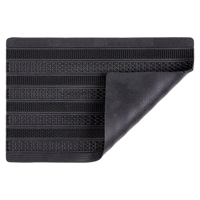 Gummimatte Rubic - 75 x 45 cm, Schwarz, 100 % Gummi - Schwarze texturierte Gummimatte, teilweise angehoben, um die Unterseite zu zeigen.