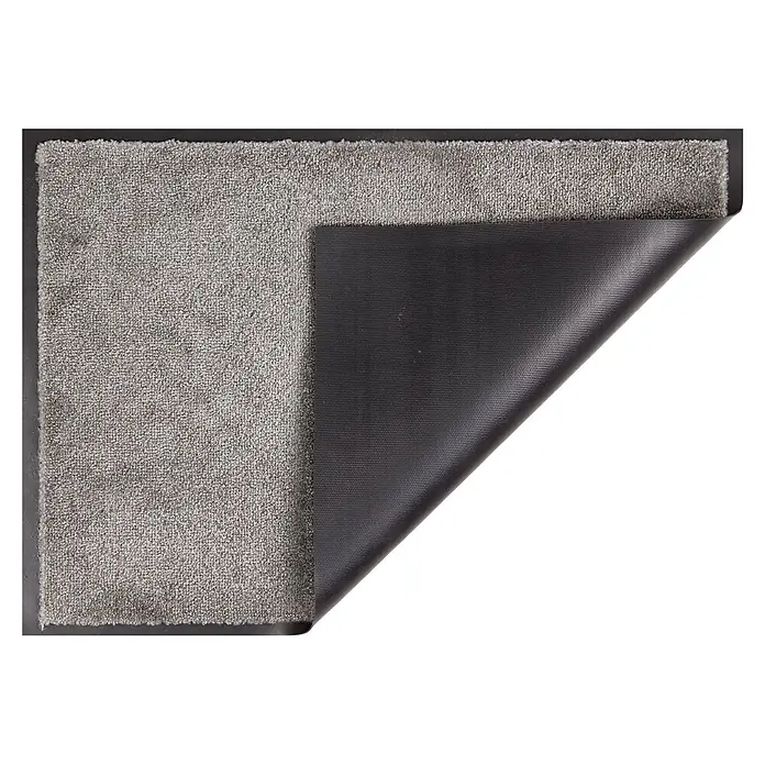 Fußmatte Miami - 70 x 50 cm, Graphit, Material Nutzschicht: 100 % Polyamid - Grauer, texturierter Teppich mit angehobener Ecke, die die schwarze, rutschfeste Rückseite zeigt.
