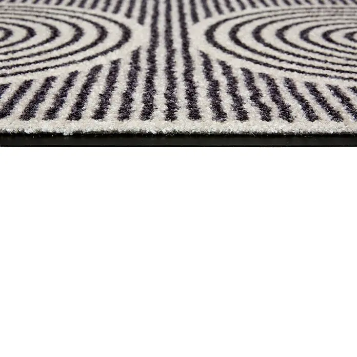 Fußmatte Bellevue - 100 x 67 cm, Creme, Material Nutzschicht: 100 % Polyamid, Semi-Circles - Nahaufnahme eines schwarz-weißen gemusterten Teppichs mit Kreisen und Streifen, zeigt die strukturierte Oberfläche und den Rand.