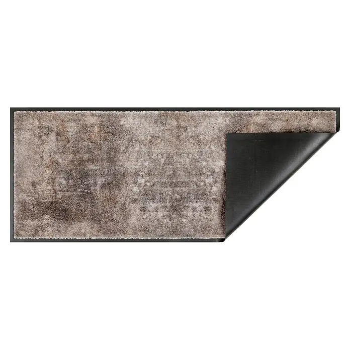 Fußmatte Miami - 150 x 67 cm, Grau, Material Nutzschicht: 100 % Polyamid, Beton - Rechteckiger grau-brauner Teppich mit strukturierter, schwarzer Antirutsch-Unterseite, die durch eine hochgeklappte Ecke sichtbar wird.