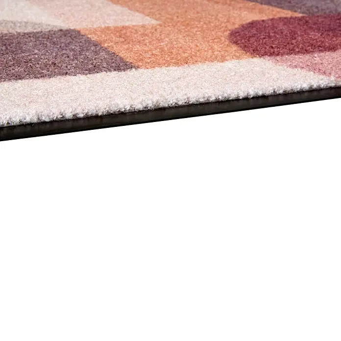Fußmatte Bellevue - 70 x 50 cm, Terra/Rosé, Material Nutzschicht: 100 % Polyamid, Grafik - Nahaufnahme eines gemusterten Teppichs mit braunen, orangefarbenen und rosa geometrischen Formen und schwarzem Antirutschrand.