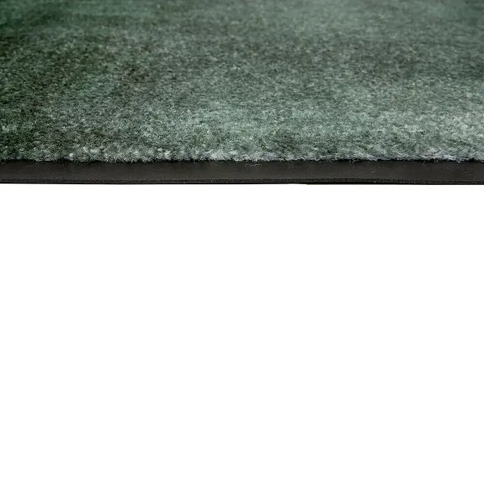 Fußmatte Miami - 100 x 67 cm, Waldgrün, Material Nutzschicht: 100 % Polyamid, Verlauf - Nahaufnahme eines dunkelgrünen, zotteligen Teppichs oder einer Matte mit schwarzem Gummirand.