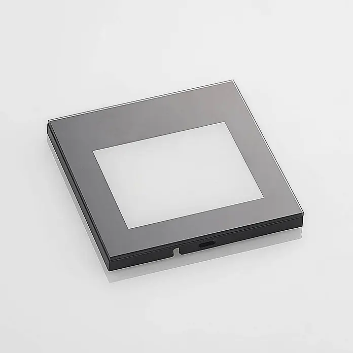 Arcchio Außenwandleuchte Zamo - schwarz, IP65 - Quadratische Leuchtbox mit schwarzem Sockel, grauem Rahmen, weiß beleuchteter Sichtfläche und seitlichem Schalter/Steckplatz.
