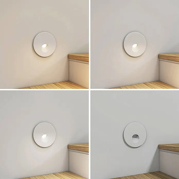 Arcchio Wandleuchte Vexi - L x B x H: 7,5 x 7,5 x 4,06 cm, weiß / opal - Weißes, rundes Wandlicht an einer Wand über Holzstufen, gezeigt mit verschiedenen Lichttemperaturen und ausgeschaltet.