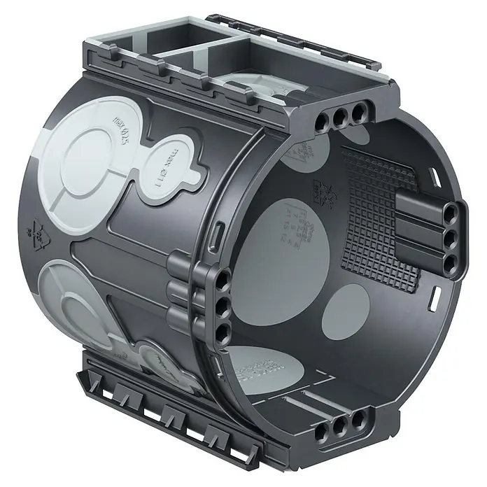 Kaiser Schalterdose 1555-25 - Ø x L: 60 x 66 mm, Schwarz - Dunkelgraue zylindrische Elektroabzweigdose mit hellgrauen Ausbrechöffnungen und mehreren Kabeleinführungen.