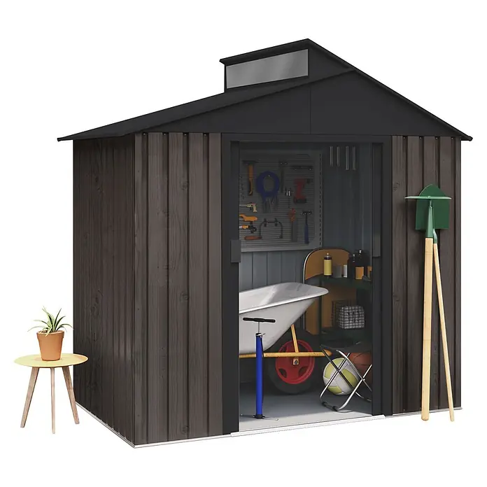 Hoggar Gerätehaus Aran THW - Außenmaß inkl. Dachüberstand (B x T): 240 x 149 cm, Stahl, Anthrazit - Dunkelgraues Holzgartenhaus mit offener Tür, das Werkzeuge, eine Schubkarre und Sportgeräte zeigt. Eine Pflanze, Schaufel und Hacke sind draußen.