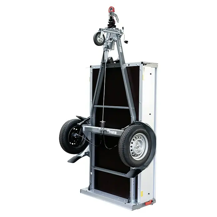 Stema Anhänger BASIC 1000 Kompakt - Nutzlast: 830 kg, Einachser, Kasteninnenmaß: 201 x 108 x 33 cm, Gebremst - Bild eines Schwenkstützenradträgers mit zwei Rädern an einer Kiste.