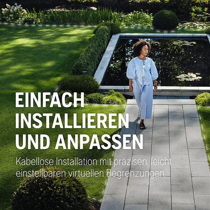 Husqvarna Mähroboter Aspire R6V - 600 m², Schnittbreite: 22 cm, Satellitengestützte Navigation, GPS - Gestrichelte weiße Linien zeigen virtuelle Begrenzungen auf einem grünen Rasen im Garten.