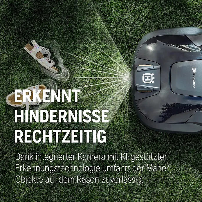 Husqvarna Mähroboter Aspire R6V - 600 m², Schnittbreite: 22 cm, Satellitengestützte Navigation, GPS - Grauer Husqvarna Mähroboter erkennt Sandalen auf dem Rasen.