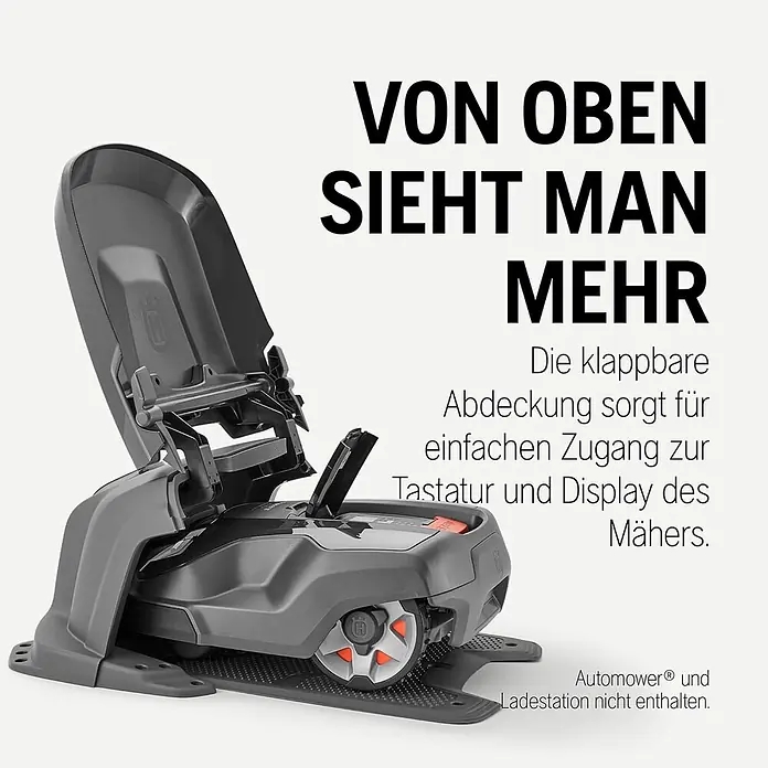 Husqvarna Mähroboter-Garage Aspire R6V, 305, 310, 315, 405X, 415X - L x B x H: 88,4 x 62,7 x 66 cm, Grau, Aspire R6V, 305, 310, 315, 405X und 415X - Dunkelgraues Mähroboter-Schutzhaus mit geöffneter Klappabdeckung, die Bedienelemente des Mähers freilegend.