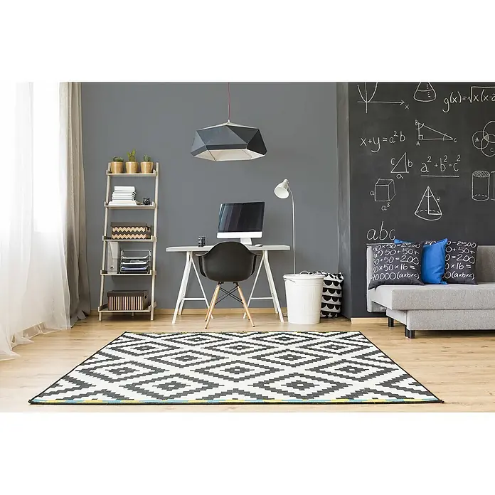 Livingwalls Wandfarbe Grau Cool Grey DD125751 5l - Grau, Matt, 5 l - Großer schwarz-weißer Teppich mit geometrischem Muster auf hellem Holzboden in modernem Arbeitszimmer mit Tafelwand.