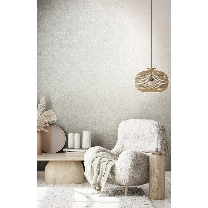 Livingwalls Vliestapete Grafisch, weiß-grau - 10.050 x 530 mm - Ein gemütliches Wohnzimmer mit einer geflochtenen Rattan-Pendelleuchte, einem flauschigen Sessel und Deko auf einem Holztisch.