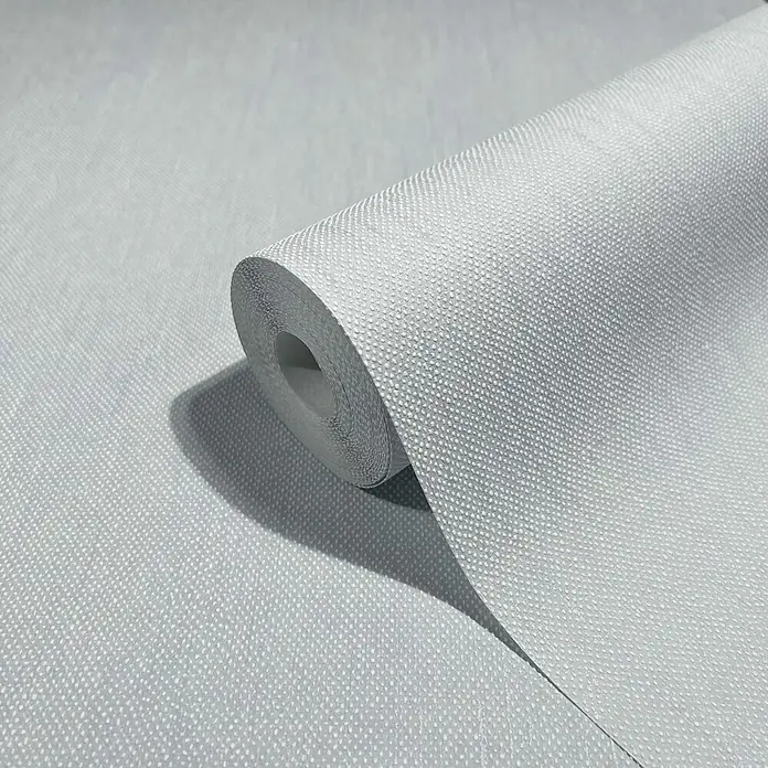 Livingwalls Vliestapete Struktur, hellblau - 10.050 x 530 mm - Heller grauer strukturierter Tapetenrolle mit dezentem Punktmuster, teilweise ausgerollt.