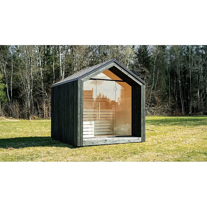 Weka Saunahaus Luua - L x B x H: 249 x 234 x 244 cm, Schwarz, Mit 9 kW Ofen mit integrierter Steuerung - Moderne dunkle Holzsauna mit großer Glasfront und hellem Holzinterieur, in einer grünen Naturlandschaft mit Bäumen.