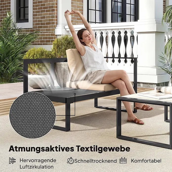 Outsunny Loungemöbel-Set - Khaki - Frau entspannt auf schwarzem Outdoor-Sofa mit beigen Kissen aus atmungsaktivem Textilgewebe, mit passendem Couchtisch.