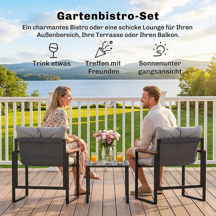 Outsunny Loungemöbel-Set - Grau - Zwei Personen entspannen auf einem schwarzen Metall-Bistro-Set mit grauen Polstern auf einer Terrasse. Das Set umfasst zwei Stühle und einen kleinen Tisch.