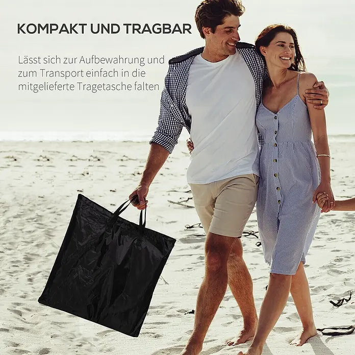 Outsunny Gartenliegen-Set - B x T: 48 x 134 cm, Schwarz, Stahl, Klappbar - Mann trägt eine schwarze, gefaltete Tragetasche am Strand. Kompakt und tragbar.