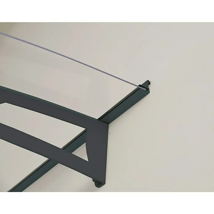 Palram – Canopia Pultvordach Aquila - 453,5 x 91,5 x 17,5 cm, Anthrazitgrau, Farbe Dach: Klar - Nahaufnahme eines modernen Glasvordachs mit dunklem Metallrahmen, das an einer weißen Wand befestigt ist und Schutz vor Wettereinflüssen bietet.