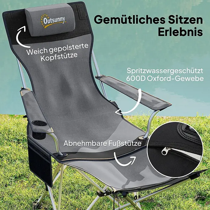 Outsunny Campingstuhl - Oxford-Gewebe, Grau - Grauer Outsunny Campingstuhl mit gepolsterter Kopfstütze, Getränkehalter, Seitentasche und abnehmbarer Fußstütze, draußen am Wasser gezeigt.
