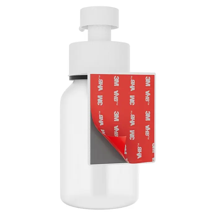 Camargue Antwerpen Seifenspender - Edelstahl, Weiß, Für die Wand - Weiße Pumpspenderflasche mit teilweise abgezogener 3M VHB Klebepad-Folie, die den dunkelgrauen Klebstoff zeigt.