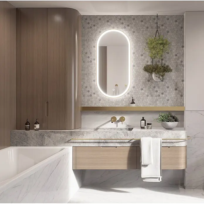 Cordia Lichtspiegel - 50 x 100 cm, Gold - Modernes Badezimmer mit Waschtisch aus Marmor und Holz, ovalem beleuchtetem Spiegel und sechseckiger Fliesenwand.