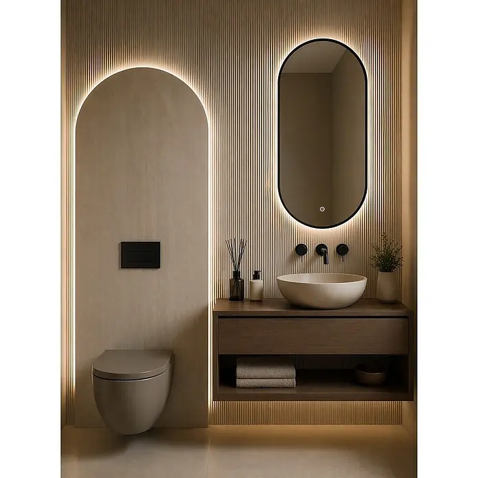 Cordia Lichtspiegel - 50 x 100 cm, Schwarz - Modernes beigegraues Wand-WC und schwebender Waschtisch aus dunklem Holz mit Aufsatzwaschbecken, umrahmt von warmer Beleuchtung im Bad.