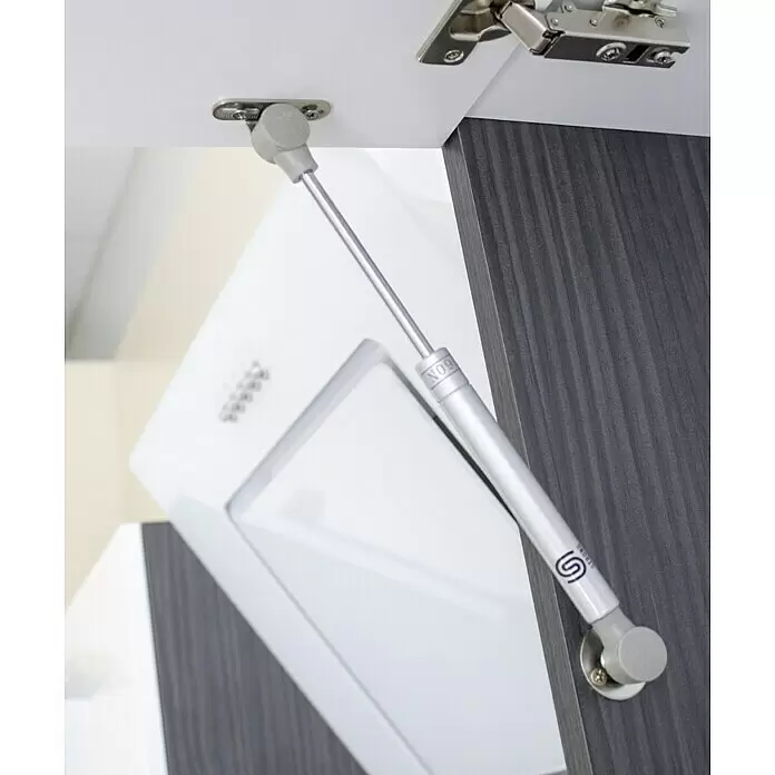 Respekta Premium Composición de cocina Amanda - Ancho: 280 cm, Roble/Blanco, Con electrodomésticos - Amortiguador de gas plateado '60N STRONG' sosteniendo puerta de armario abierta en partes blancas y gris oscuro.
