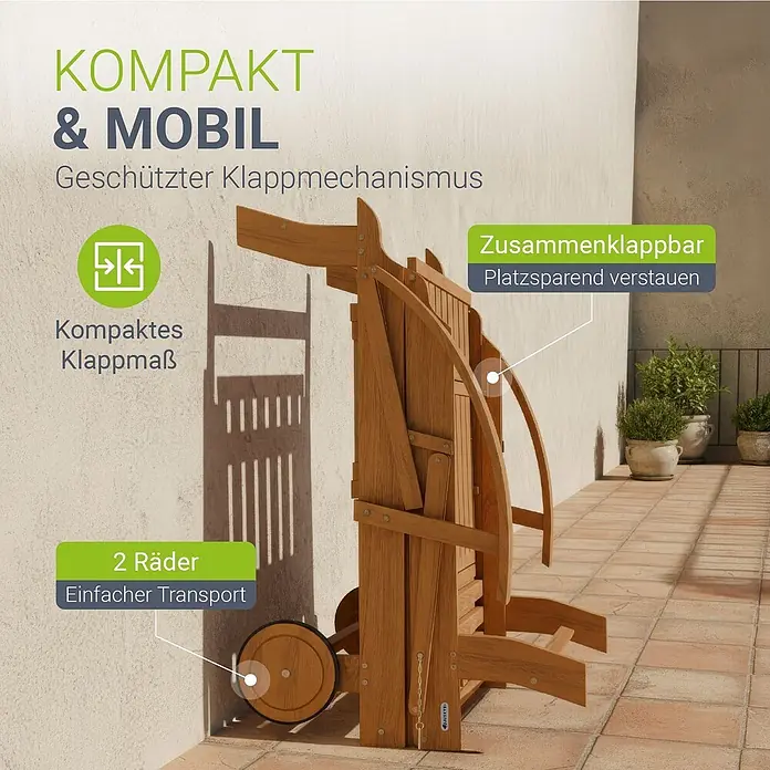 Juskys Gartenliege SunScape - B x T: 72,5 x 196 cm, Natur, Holz, Rollbar - Gefaltete Holz-Sonnenliege mit Rädern, kompakt an einer Terrassenwand gezeigt. Zeigt platzsparendes Design und einfachen Transport.