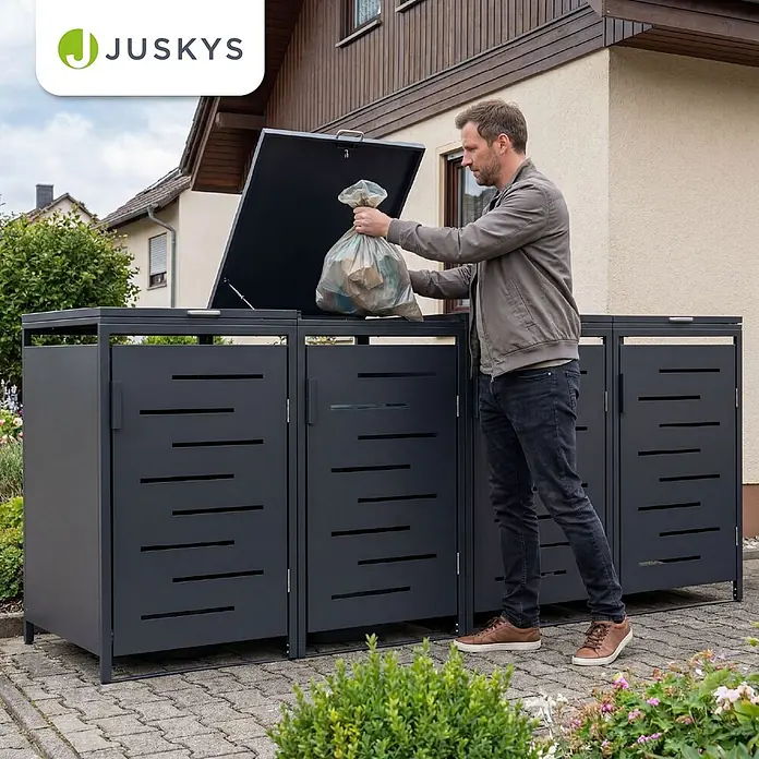 Juskys Mülltonnenbox Arel - 272 x 80 cm, Metall, Anthrazit, Geeignet für Anzahl Mülltonnen: 4 Stk. - Mann wirft Müll in eine dunkelgraue Metall-Mülltonnenbox mit Lamellentüren im Außenbereich.
