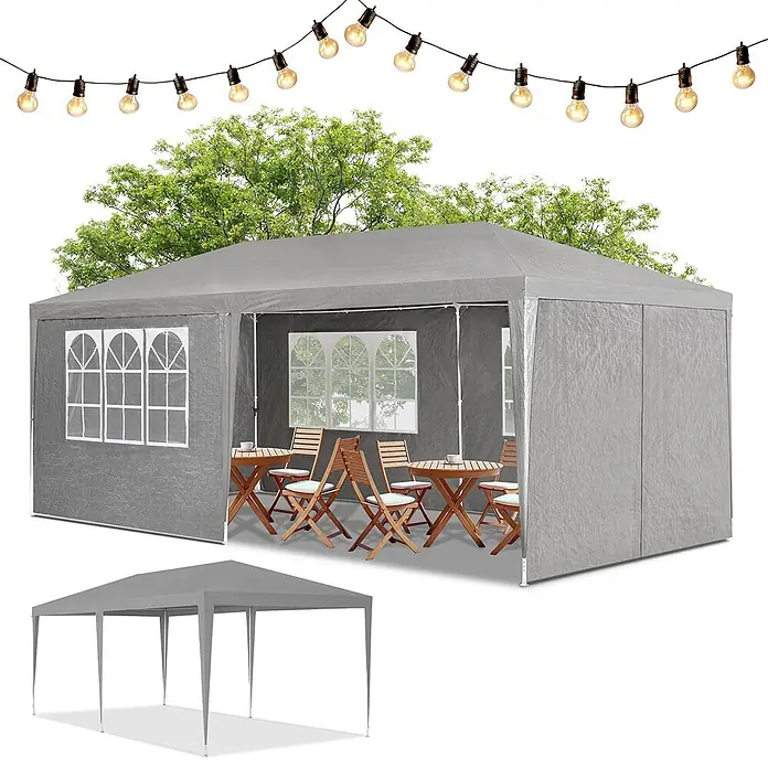 Juskys Partyzelt Gartenzelt - B x T: 300 x 600 cm, Farbe Dach: grau - Graues Partyzelt/Pavillon mit Seitenwänden & Fenstern, für eine Veranstaltung mit Möbeln unter Lichterketten aufgebaut.